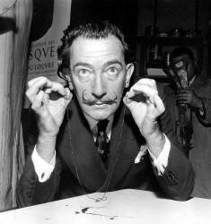 Painter Salvador Dali presenting artwork that will be destroyed by musket fire on November 16th 1956 (Rue des Archives) - Muzeo.com