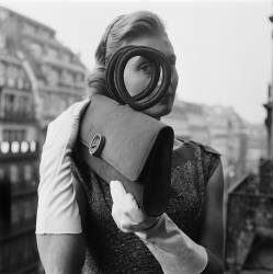 Young Woman Holding a Handbag (anonymous) - Muzeo.com